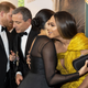 Prince Harry, Duke of Sussex (L) chats with Disney CEO Robert Iger as Meghan, Duchess of Sussex (2nd R) embraces Beyoncé (R) as they attend the European premiere of the film The Lion King on July 14, 2019.